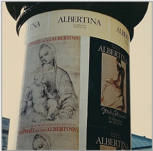 At the entrance to the Albertina, Vienna, the column displaying the posters announcing the museum's exhibitions "Raphael in der Albertina" and "Stanley Roseman - Zeichnungen aus Klostern," 1983. � Photo by Ronald Davis.